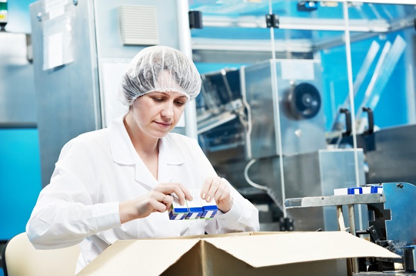 Person assessing products in a manufacturing setting