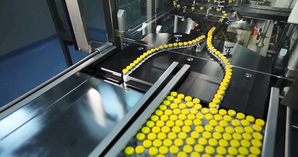 pharmaceutical manufacturing line with bottles being sorted